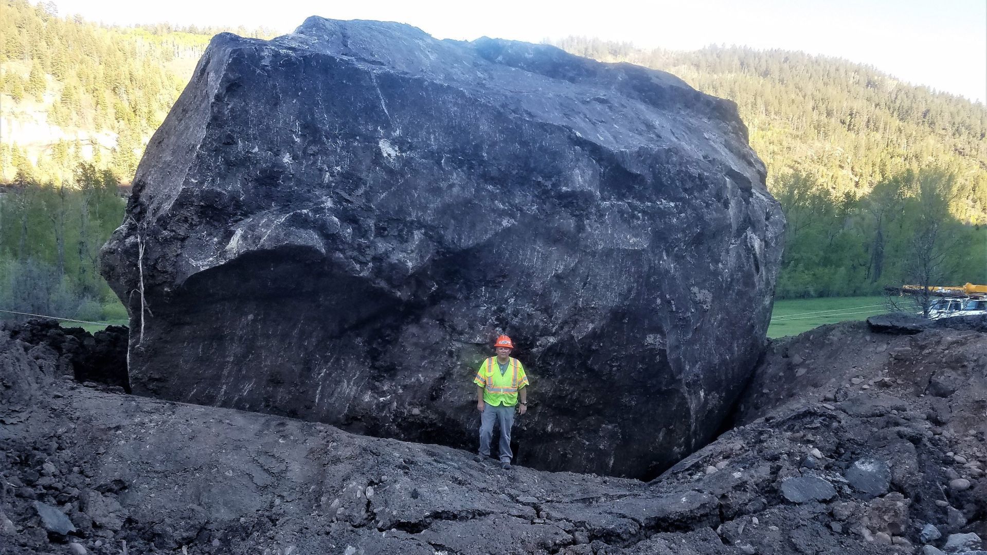 Boulder the size of a building blocks Colorado highway